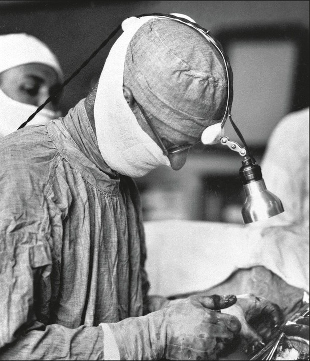 Harvey Cushing operating, with headlamp