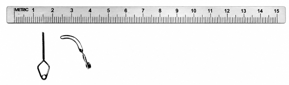 Yaşargil aneurysm clips photographed against a metric ruler